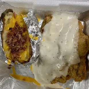 Chicken fried steak with loaded baked potato- pretty good