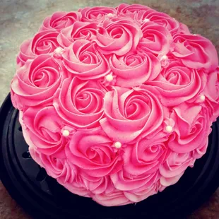 Custom cakes with rosettes.