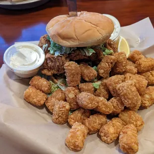 Chicken of the Sea sandwich with tots.