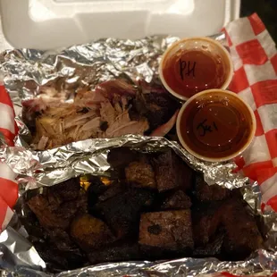 Pulled pork and brisket burnt ends, with peach habanero sauce and their jalapeño sauce. All of it was excellent!