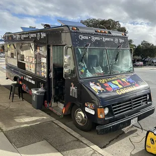 a food truck parked on the side of the road