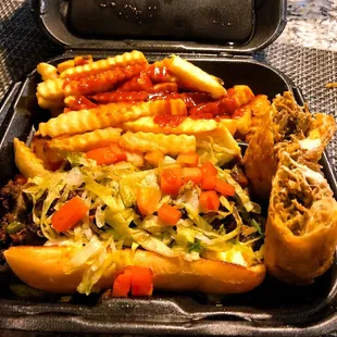 &quot;Obama&quot; Jerk Philly cheesesteak with a Jerk Chicken egg roll and a side of fries with mild sauce.