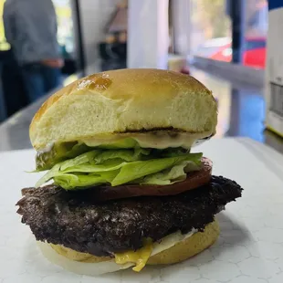 a hamburger with lettuce and tomato