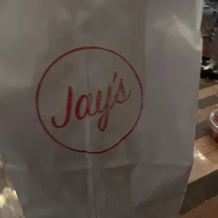 a paper bag with the word jay's on it