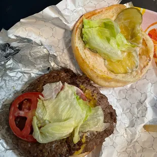 Under the hood - pickles, lettuce, tomato, cheese