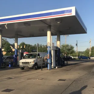 a truck parked in front of a gas station