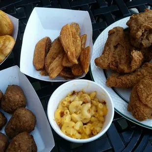 Fried chicken, mac n cheese, boudin balls, fries, and honey biscuits