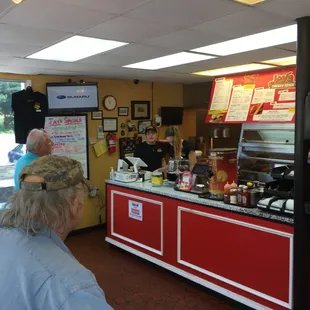 The front counter, where the inaction was - gentleman without the hat, waiting for his call in order. Hope he&apos;s not still waiting.