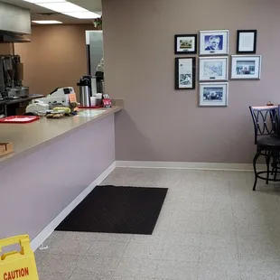 Ordering area and stool seating at front window.