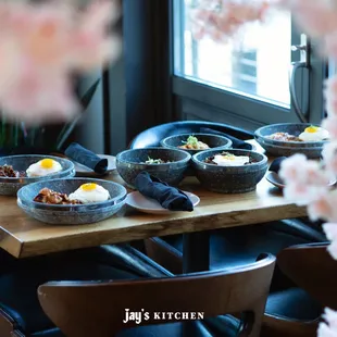 a table with bowls of food on it