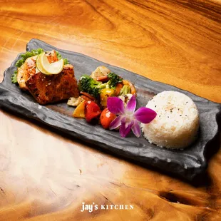 a plate of food on a wooden table