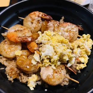 a plate of food with shrimp and rice