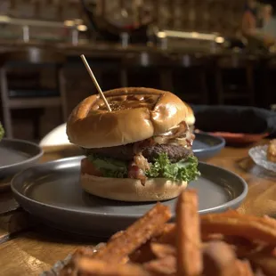 a burger and fries on a table