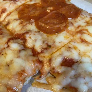a slice of pepperoni pizza