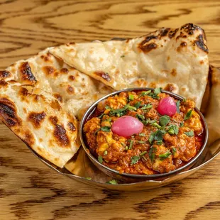 BHEJA MASALA

pan-fried brain masala, butter naan. (famous street food dish that originated in Hyderabad)