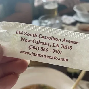 a person holding a ticket for a meal