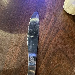 Unclean table and dirty knife