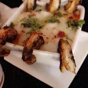 Unseasoned, watery, instant grits and burnt rubber shrimp. Nasty.