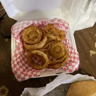 a sandwich and onion rings