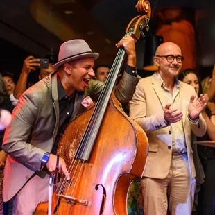a man playing a double bass