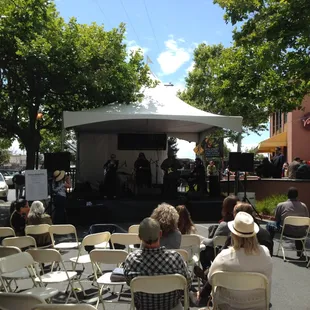 The side stage with no one sitting there yet.