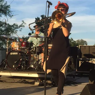a woman playing a trombone