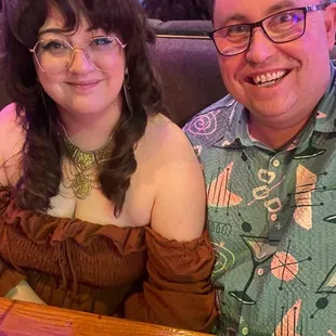 a man and a woman sitting at a table