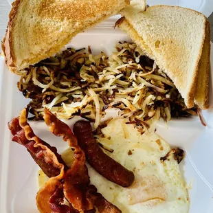 2 eggs with 4 meat: over medium, sausage links , bacon, hash brown, white toasts