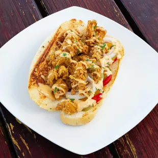 Fried Oyster Po&apos; Boy ~ With Tomatoes, Onions, Pickles and Cajun Mayo Topped with Herbs on a French Roll