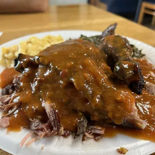 a plate of meat and gravy