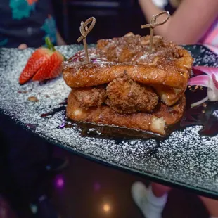 a plate of french toast and strawberries