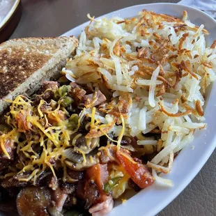 Kitchen Sink Scrambled Eggs and hash browns.