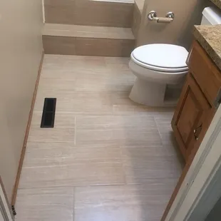 a bathroom with a toilet and tub