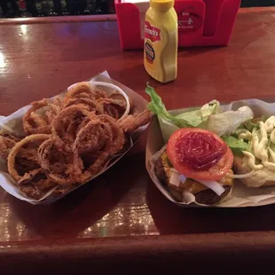 Well seasoned burger and hand made onion rings.
