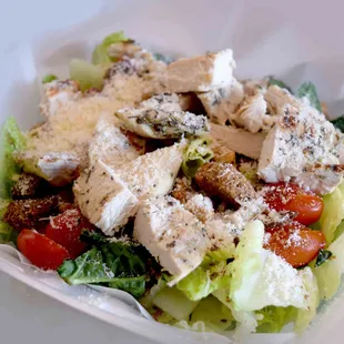 Grilled Chicken Caesar Salad. Tender leaf lettuce topped with strips of our baked boneless chicken breast.