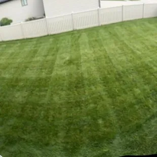 Deck view of a well-manicured yard in Hickman, NE.