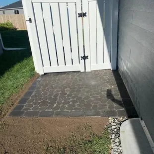 PVC fence installed on top of new paver patio in Walton, NE.