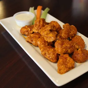 Boneless wings, topped with house spicy garlic sauce
