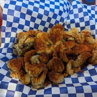 Fried pickles with pour house hot seasoning