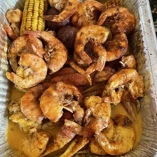 Crab Legs, Shrimp with the sides of potatoes, corn and sausage.