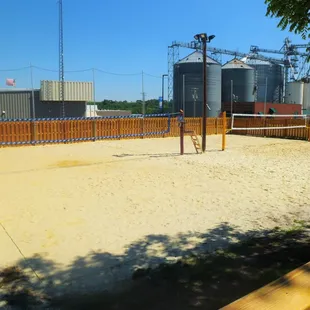 sand volleyball court and silos