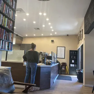 The view of the main counter in the coffee shop from the book nook corner
