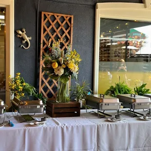 a buffet table with a variety of food items
