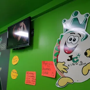 You can't not love the guy on the wall, because if you eat here often, you'll be the same shape as him.