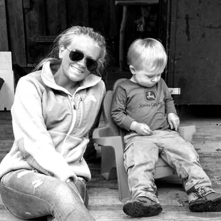 a black and white photo of a woman and a child
