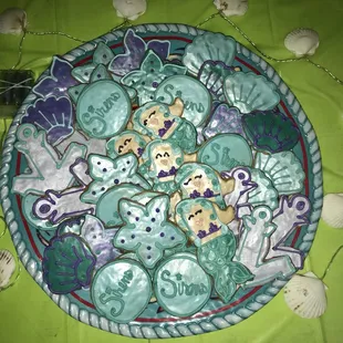 a plate of decorated cookies