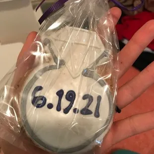 a person holding a cookie in a bag