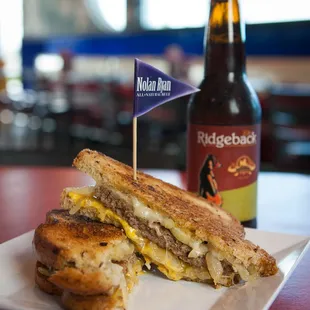  a grilled cheese sandwich on a white plate