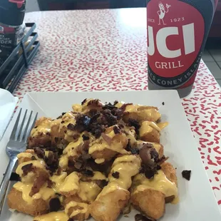 Regular tator tots with bacon &amp; cheese with a Delaware punch