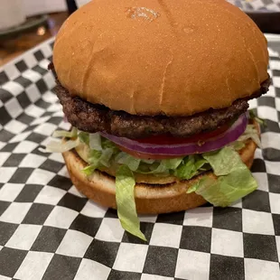 a hamburger with lettuce and tomato